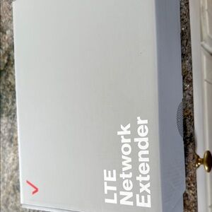 Gray LTE Network Extender. Brand new. Boxed. Never used. Not needed. Invoice